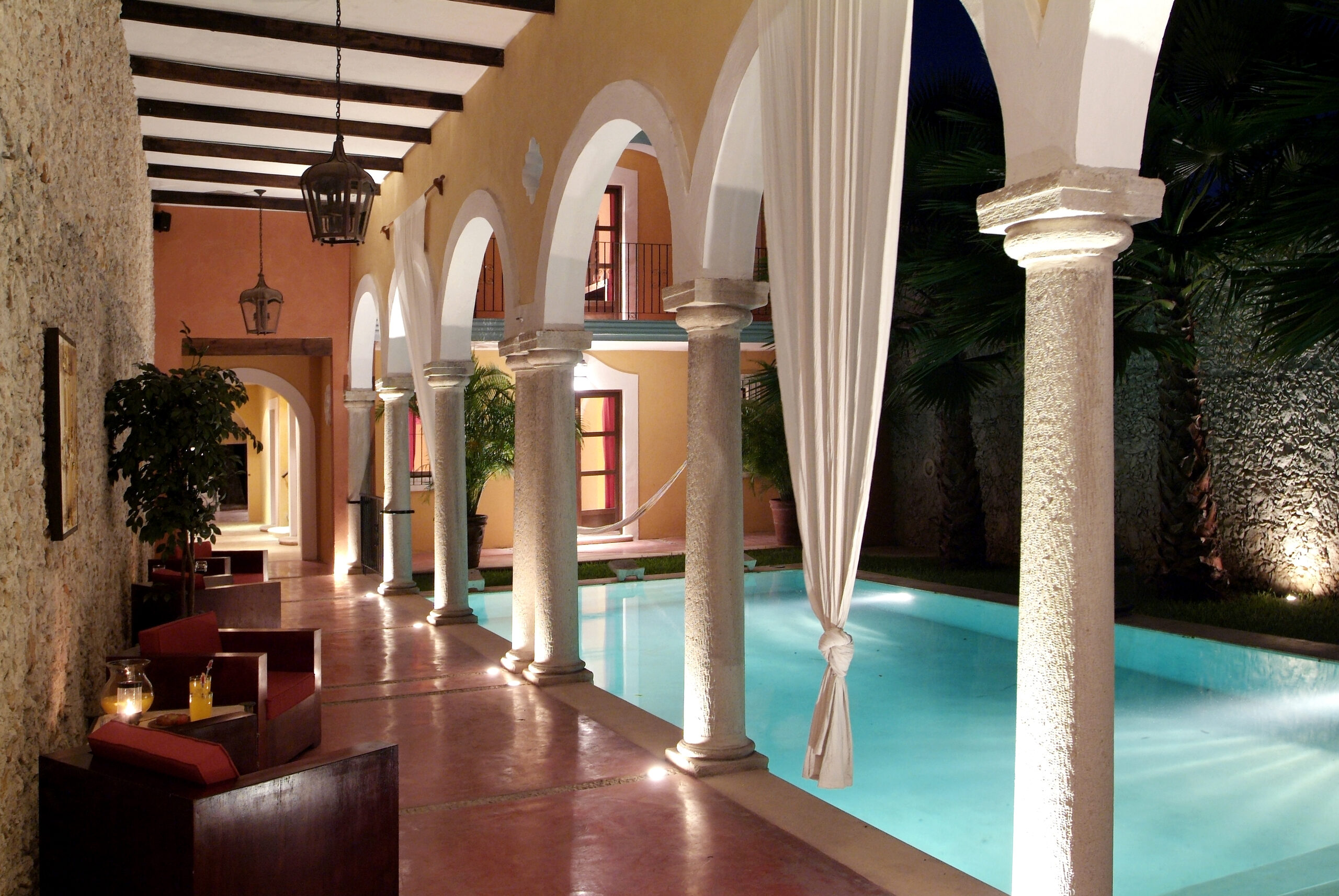 Pool arcade at night, Hotel Hacienda Mérida
