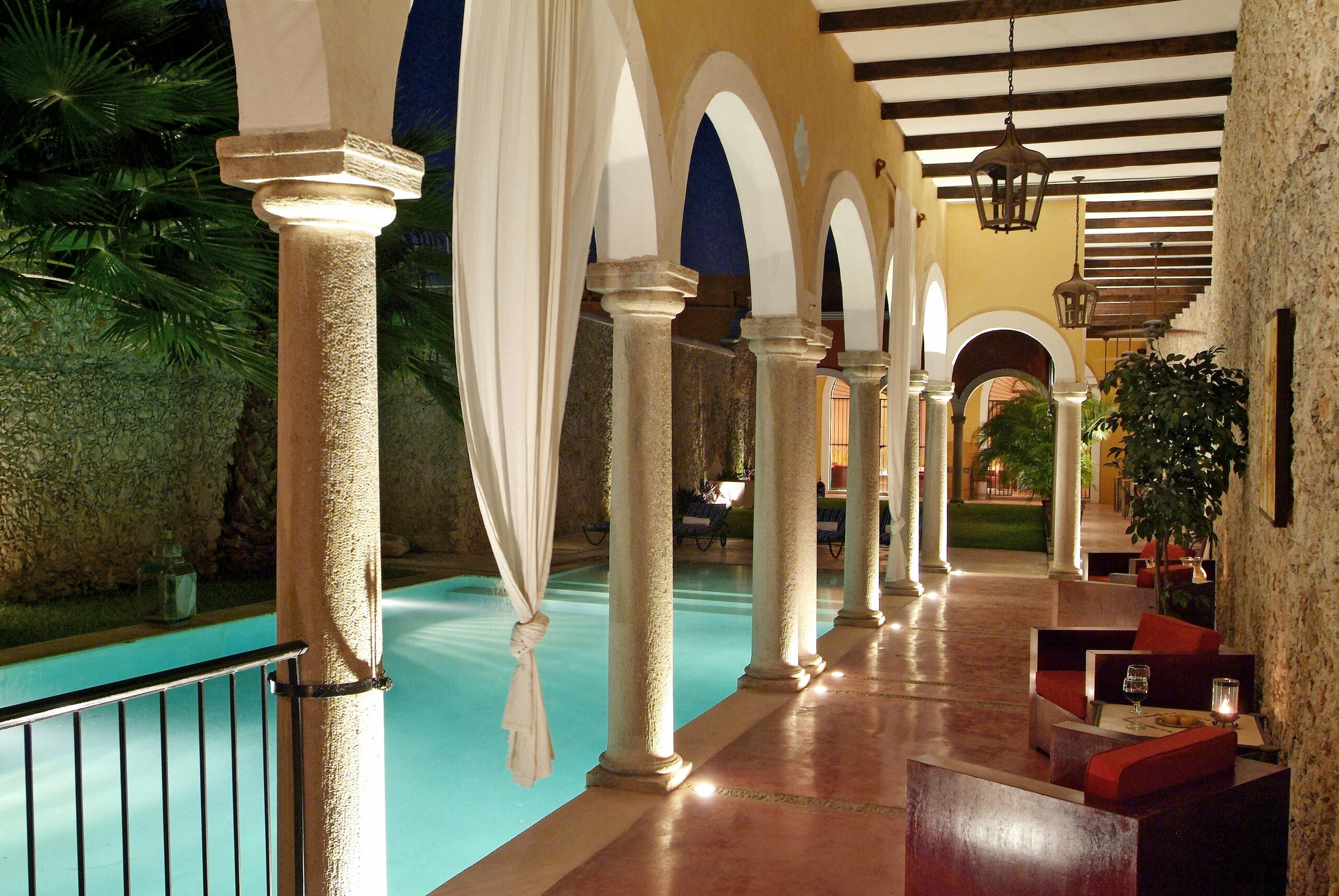 Pool and arches at night, Hotel Hacienda Mérida